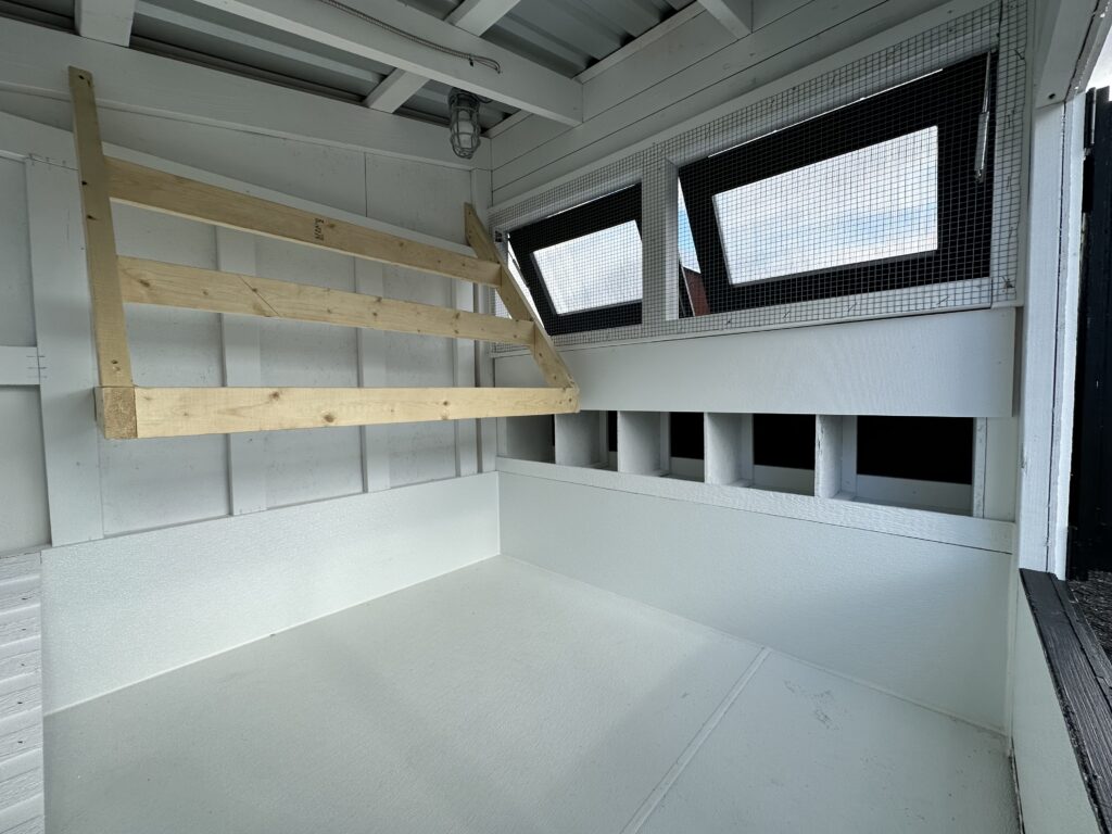 Triple roosting rods installed on the inside of coop