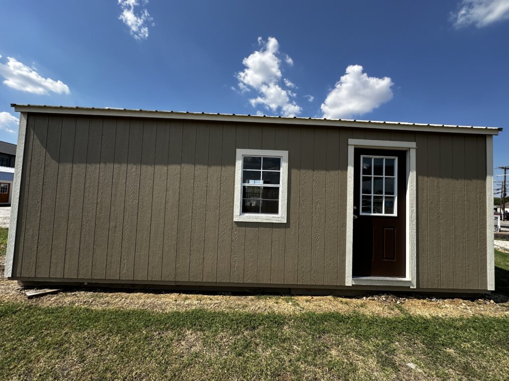 12x24 garage is painted with buckskin siding and Navajo white trim 